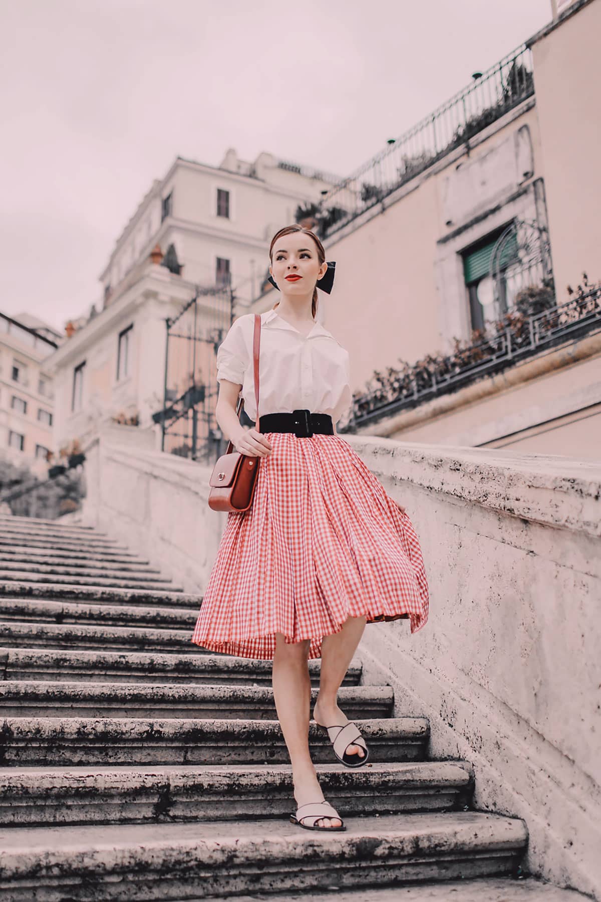Woman wearing Shein clothes on Italian staircase